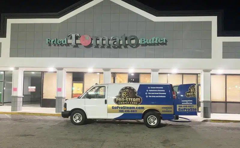 carpet cleaning van in front of fried tomato cafe